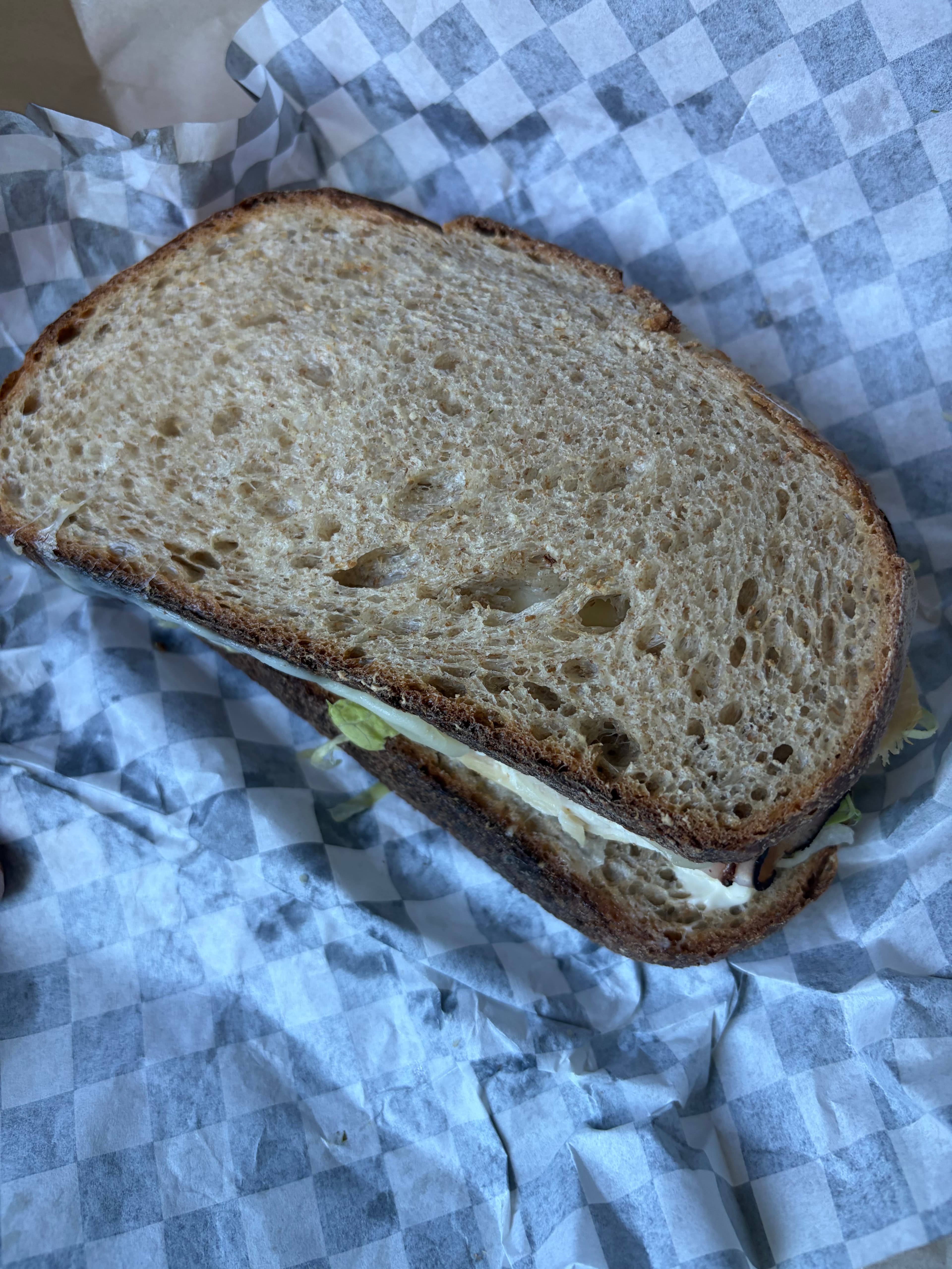 Sourdough sandwich on checkered paper