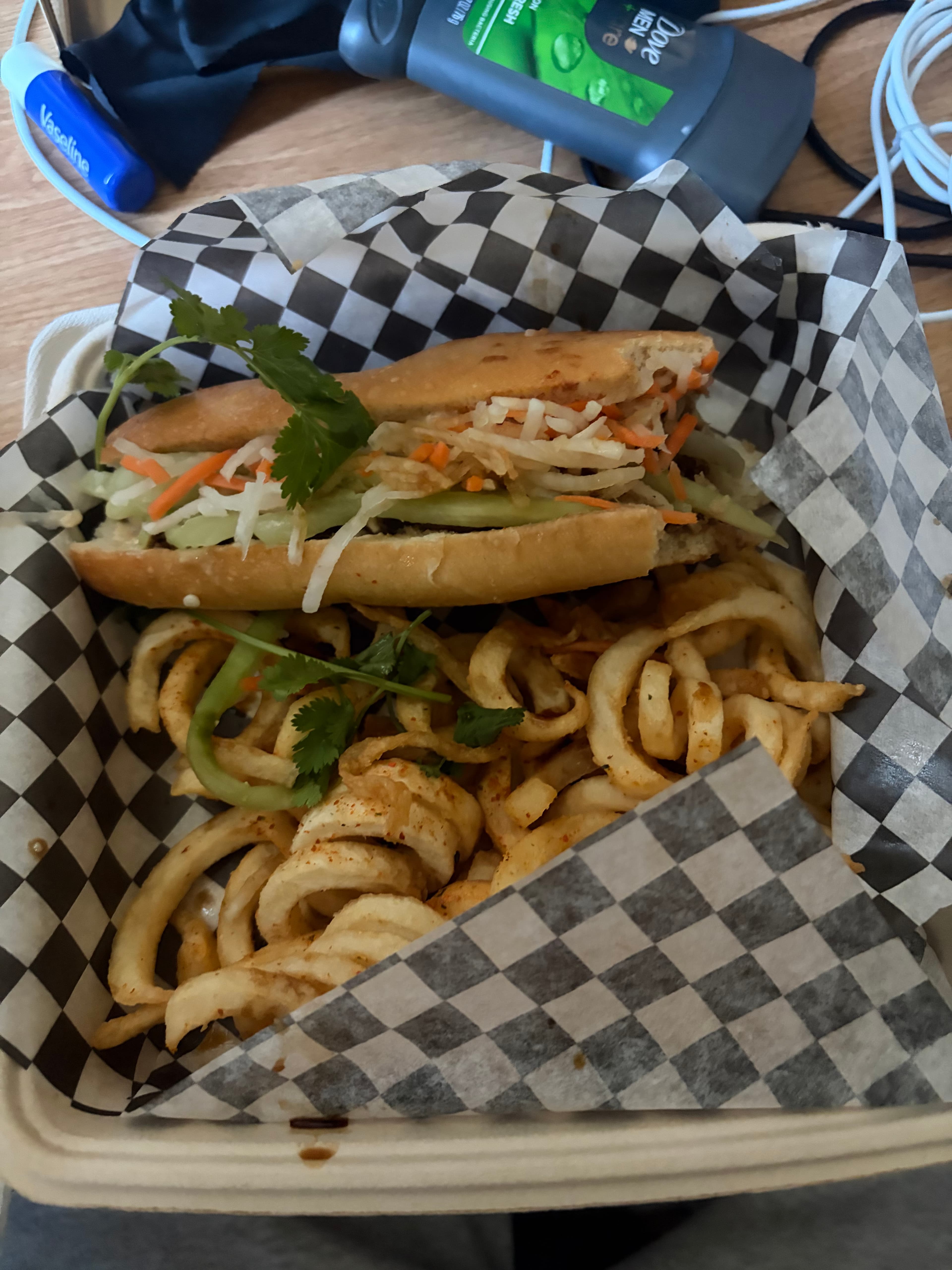 Sandwich with pickled vegetables and curly fries