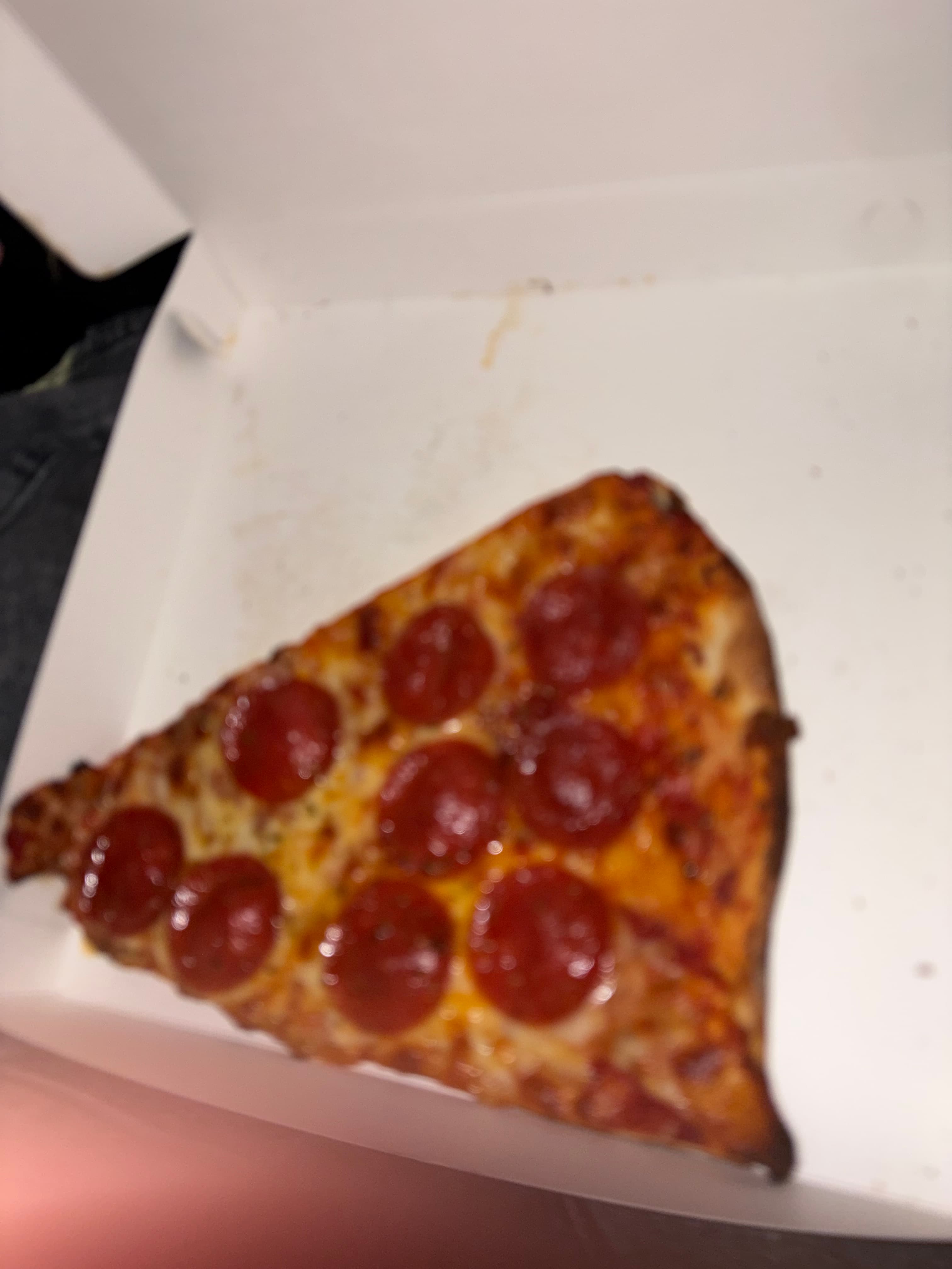 Pepperoni pizza slice in a box