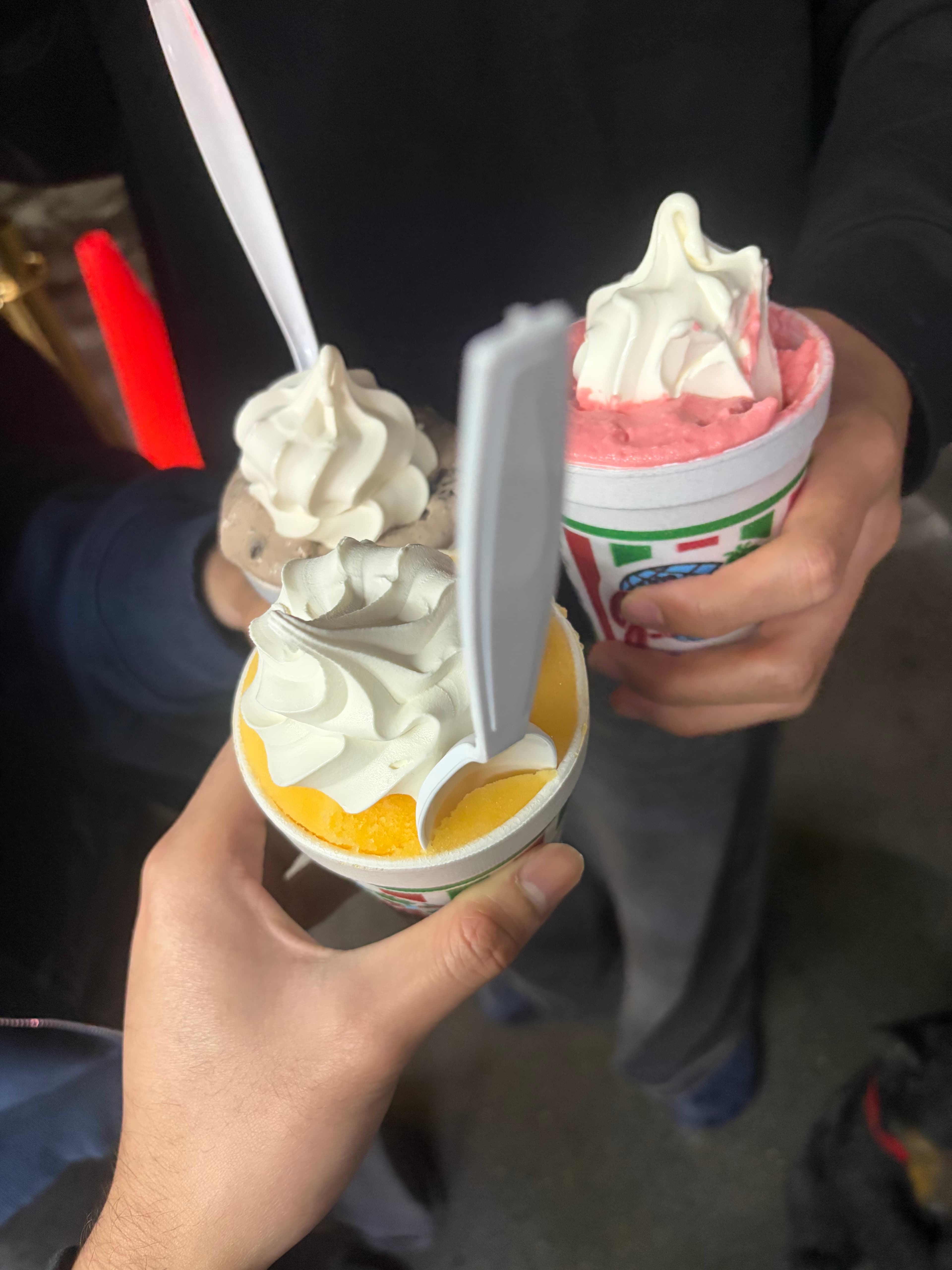 Three cups of soft serve ice cream