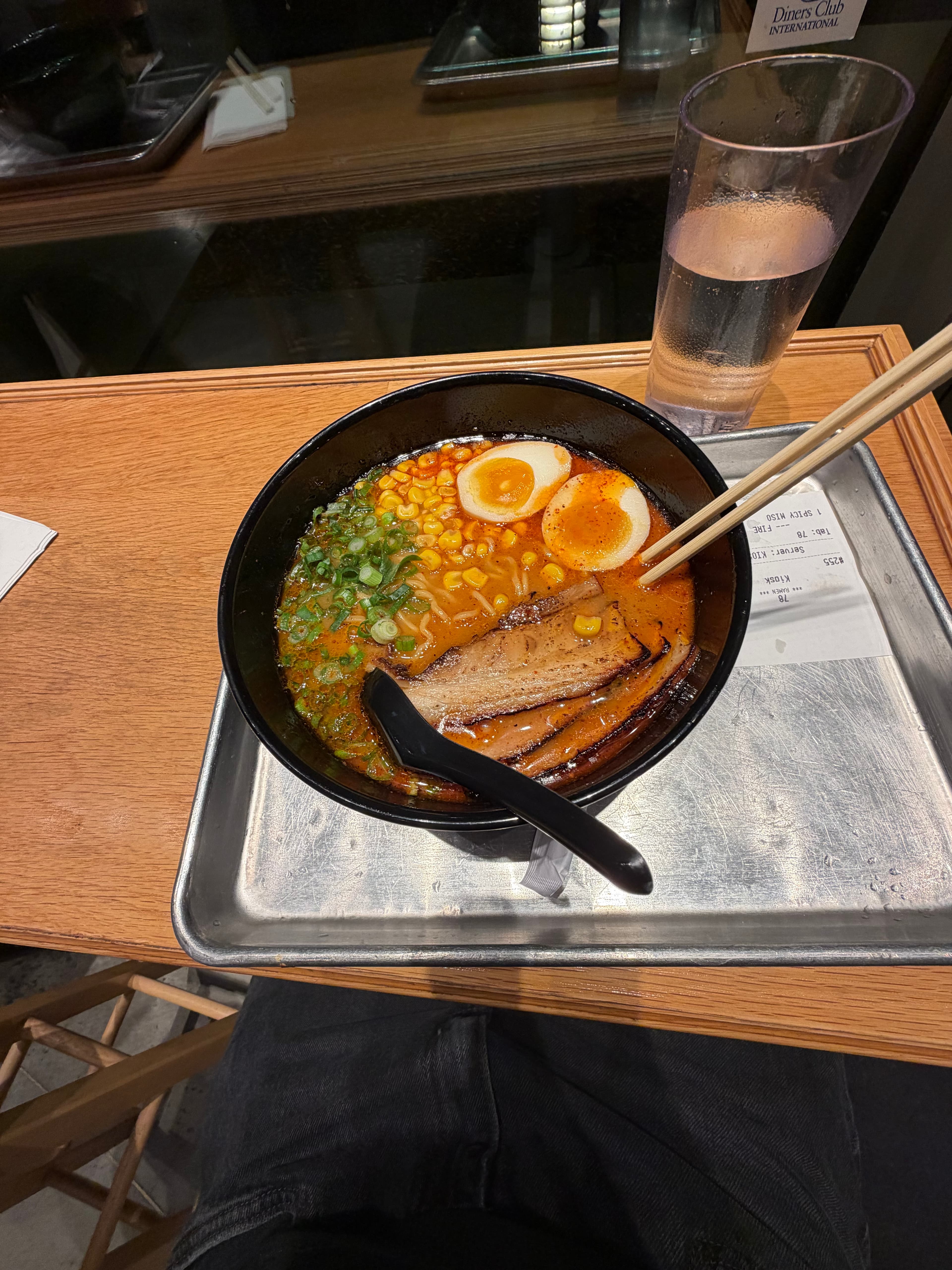 Spicy ramen bowl with corn, egg, and chashu